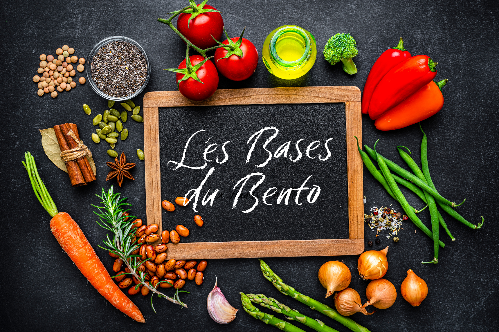 Tableau noir avec écrit "Les bases du bento" à la craie, entouré de légumes